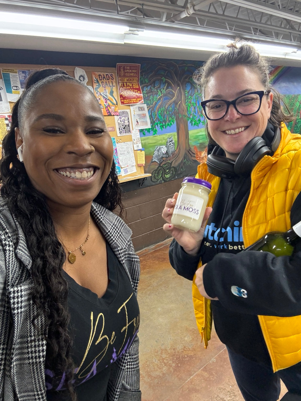 Be Free Sea Moss founder with a happy customer holding a jar